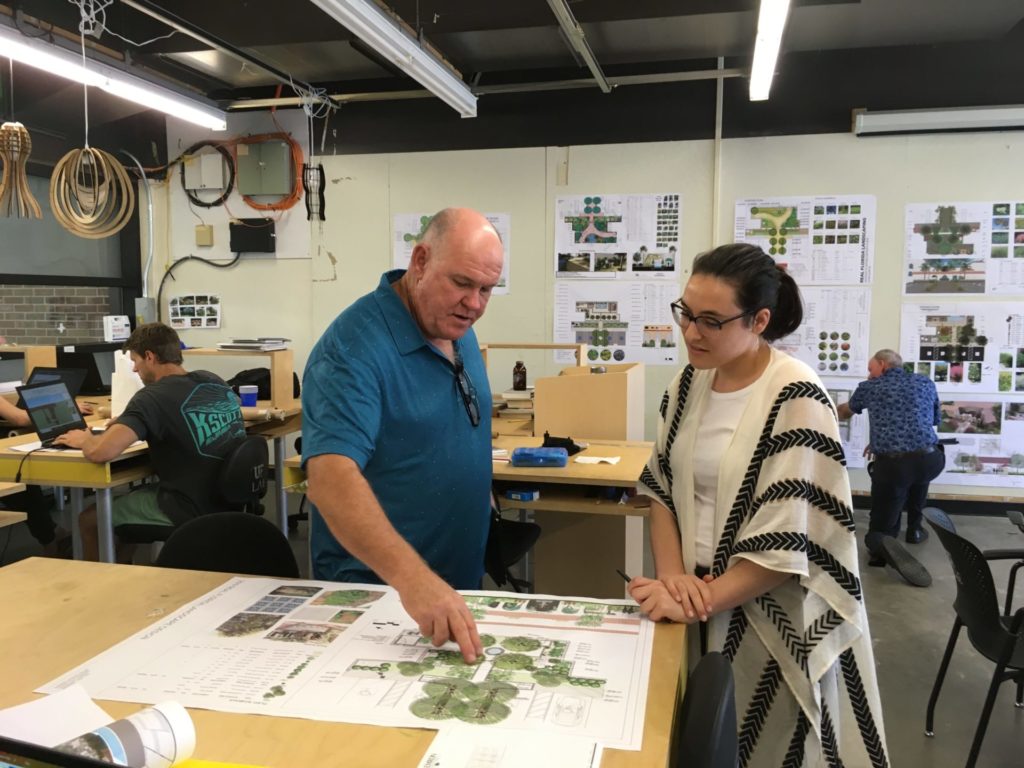 Foundation President Bruce Turley discusses plan with student